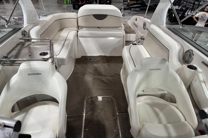 Slide: The Image of 2008 Rinker 296 Captiva Bowrider interior with white seating and carpeted floor. - 7