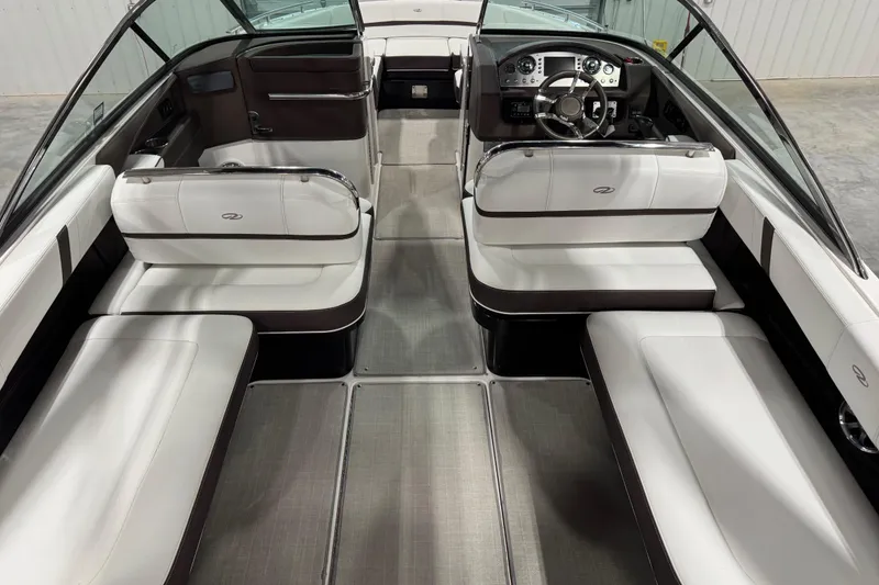 Slide: The Image of 2015 Regal 2800 Bowrider interior with sleek white seating and modern dashboard. - 10
