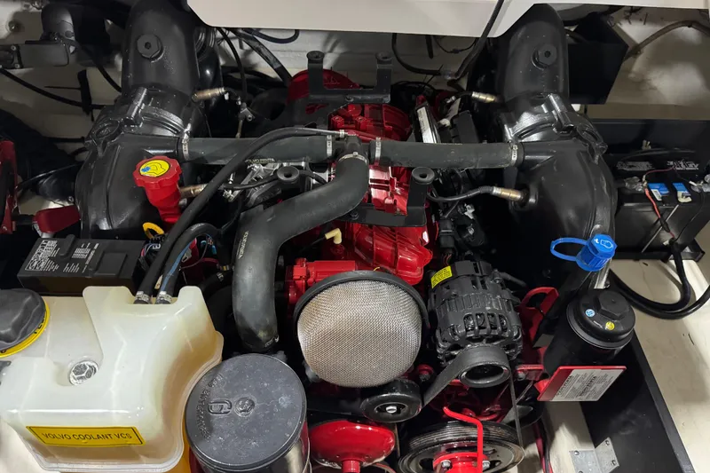Slide: The Image of Engine compartment of a 2015 Regal 2800 Bowrider boat, showcasing detailed components. - 13