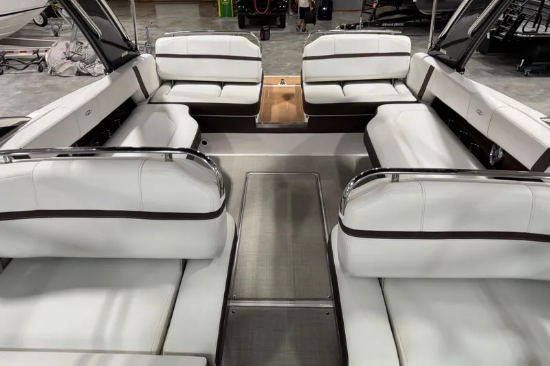 Slide: The Image of 2015 Regal 2800 Bowrider interior with white seating and spacious layout. - 6
