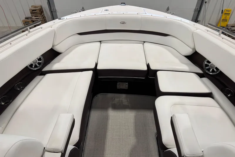 Slide: The Image of 2015 Regal 2800 Bowrider interior with white cushioned seating and modern design. - 7