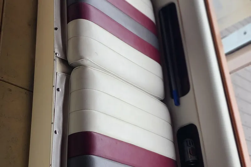Slide: The Image of Interior seating of 1987 Sea Ray 340 Sundancer with red and white upholstery. - 10