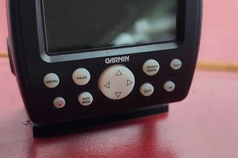 Slide: The Image of Garmin navigation device on 1987 Sea Ray 340 Sundancer boat dashboard. - 11