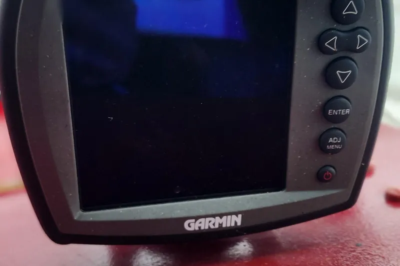 Slide: The Image of Garmin marine GPS device on 1987 Sea Ray 340 Sundancer boat dashboard. - 13