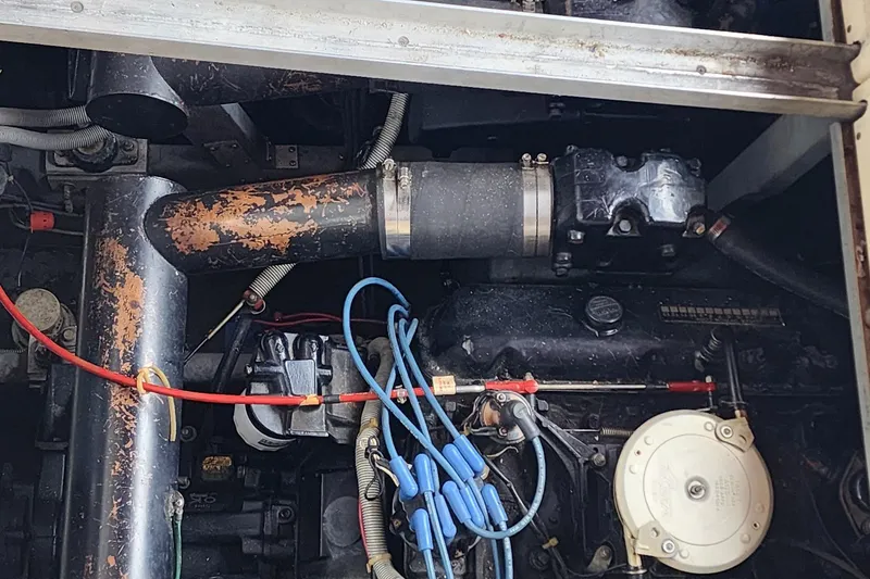 Slide: The Image of Engine compartment of a 1987 Sea Ray 340 Sundancer boat, showing mechanical components. - 19