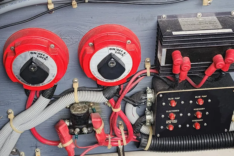 Slide: The Image of Electrical panel of a 1987 Sea Ray 340 Sundancer boat with switches and wiring. - 21