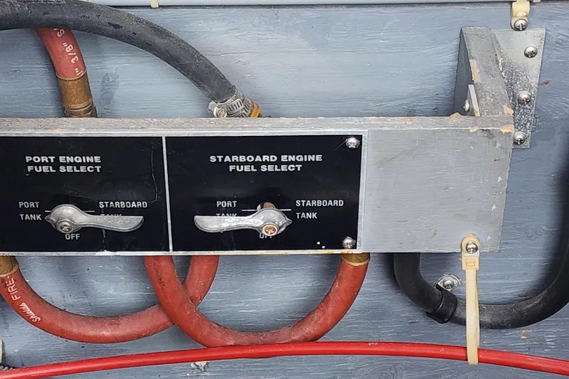 Slide: The Image of Fuel selection panel on a 1987 Sea Ray 340 Sundancer boat, showing port and starboard options. - 24