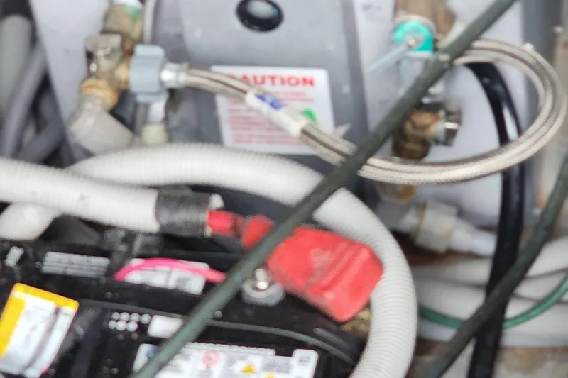 Slide: The Image of Engine compartment of 1987 Sea Ray 340 Sundancer with battery and wiring. - 27