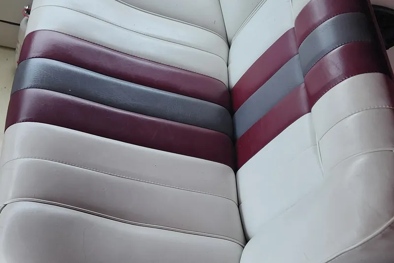 Slide: The Image of Striped boat seat upholstery in maroon, gray, and white on 1987 Sea Ray 340 Sundancer. - 5