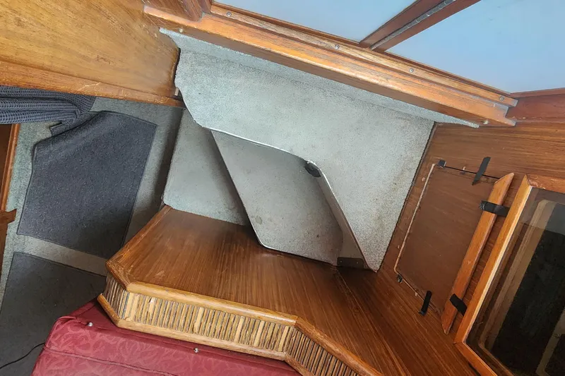 Slide: The Image of Interior cabin of 1987 Sea Ray 340 Sundancer with wood and carpet details. - 7
