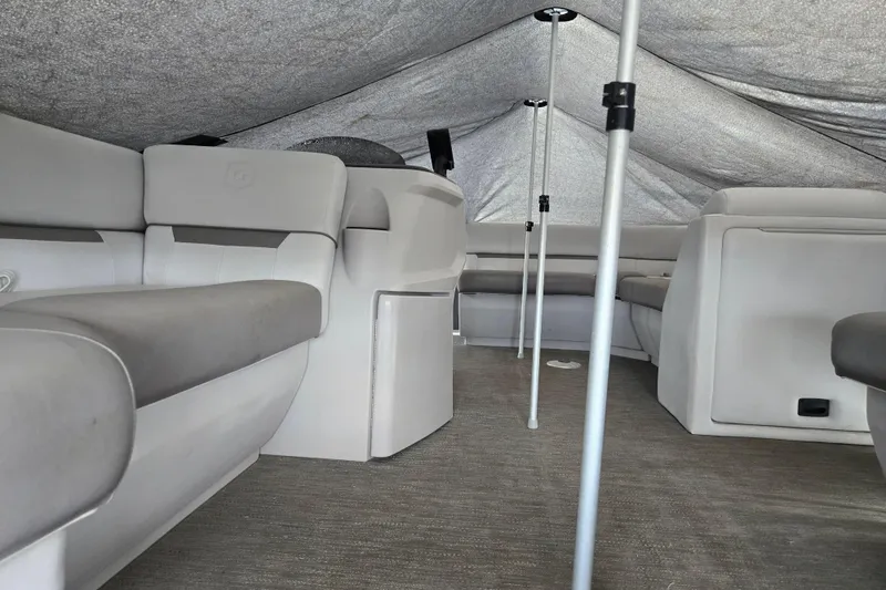 Slide: The Image of 2023 Godfrey Sweetwater 2086 CX interior with covered seating and poles. - 3