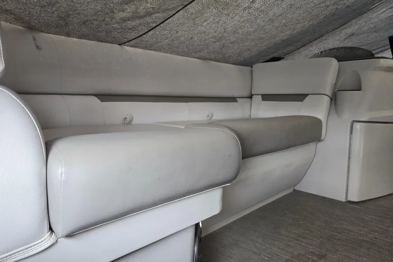 Slide: The Image of 2023 Godfrey Sweetwater 2086 CX interior with gray seating and carpeted flooring. - 4