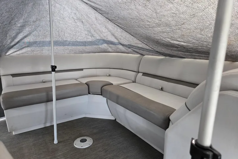 Slide: The Image of 2023 Godfrey Sweetwater 2086 CX interior with cushioned seating under canopy. - 7