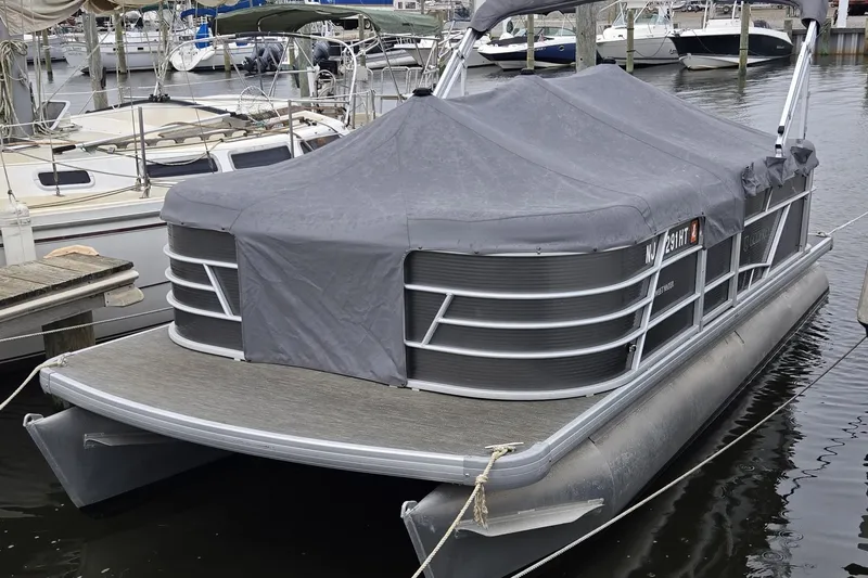Slide: The Image of 2023 Godfrey Sweetwater 2086 CX pontoon boat covered at marina dock. - 9