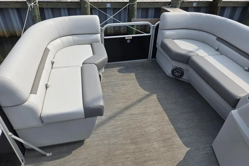 Slide: The Image of Interior of 2023 Godfrey Sweetwater 2086 CX pontoon boat with gray seating and carpet. - 4