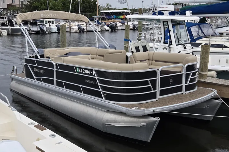 The Image of 2023 Godfrey Sweetwater 2186 C pontoon boat docked at marina. - 0