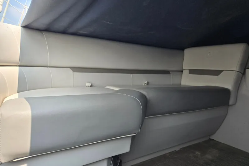 Slide: The Image of 2023 Godfrey Sweetwater 2286 SBX interior seating, featuring sleek gray upholstery. - 7