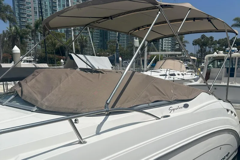 Slide: The Image of 2007 Chaparral Signature 250 boat docked at marina with canopy and cover. - 6