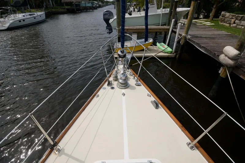 Slide: The Image of Bow of 1985 Tartan 40 sailboat docked in a marina. - 12