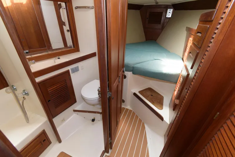 Slide: The Image of 1985 Tartan 40 sailboat interior with bathroom and sleeping quarters. - 23