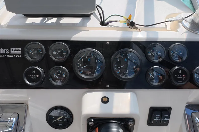 Slide: The Image of 1992 Luhrs 300 Tournament dashboard with gauges and controls. - 13