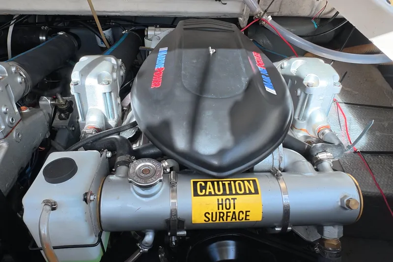 Slide: The Image of Engine compartment of a 1992 Luhrs 300 Tournament boat with caution label. - 15