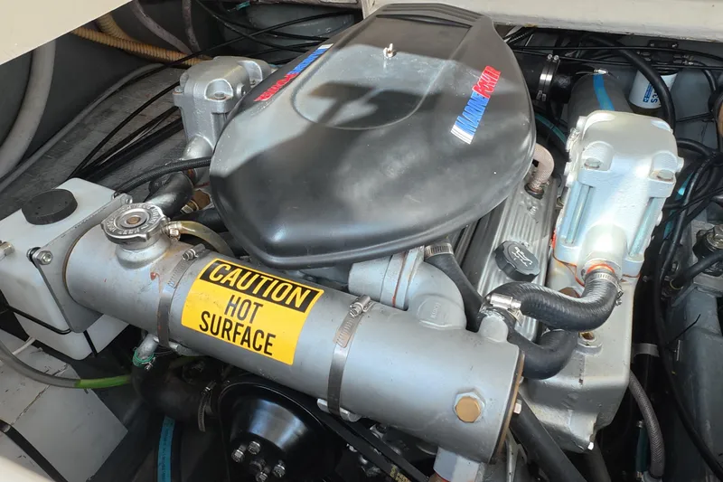 Slide: The Image of Engine compartment of a 1992 Luhrs 300 Tournament boat with caution label. - 16