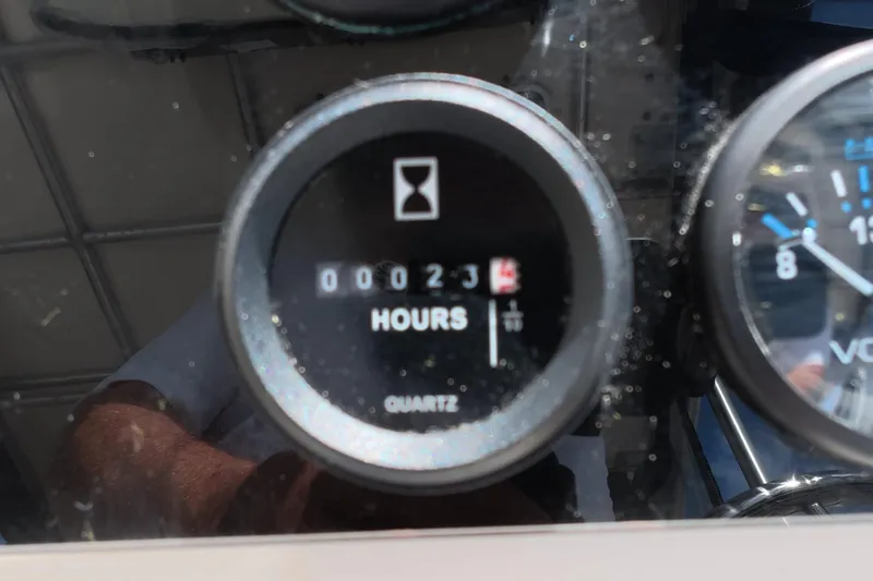 Slide: The Image of Hour meter reading 23 hours on 1992 Luhrs 300 Tournament boat dashboard. - 18