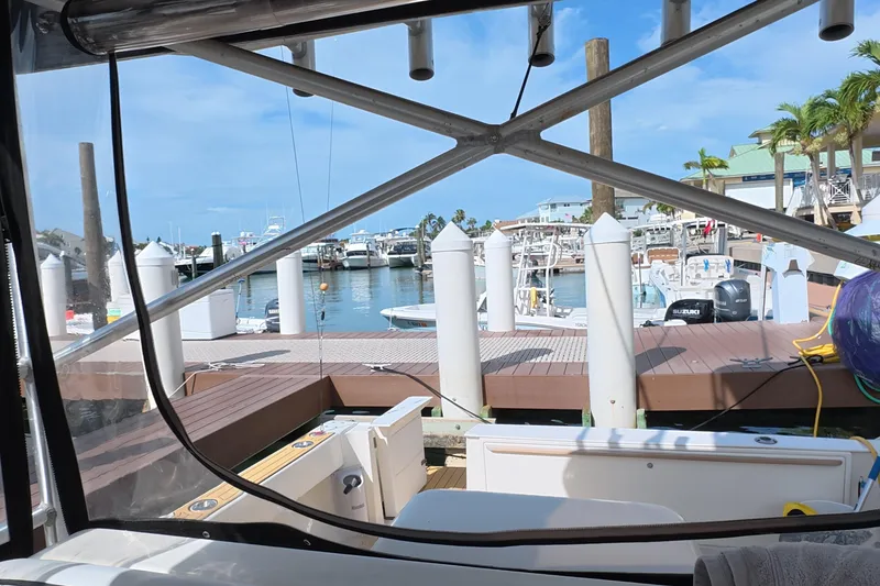 Slide: The Image of View from 1992 Luhrs 300 Tournament boat docked at a marina with clear skies. - 22