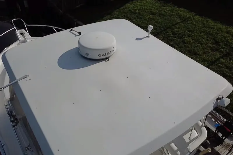 Slide: The Image of Rooftop view of 2008 Luhrs 35 Convertible boat with Garmin radar. - 10