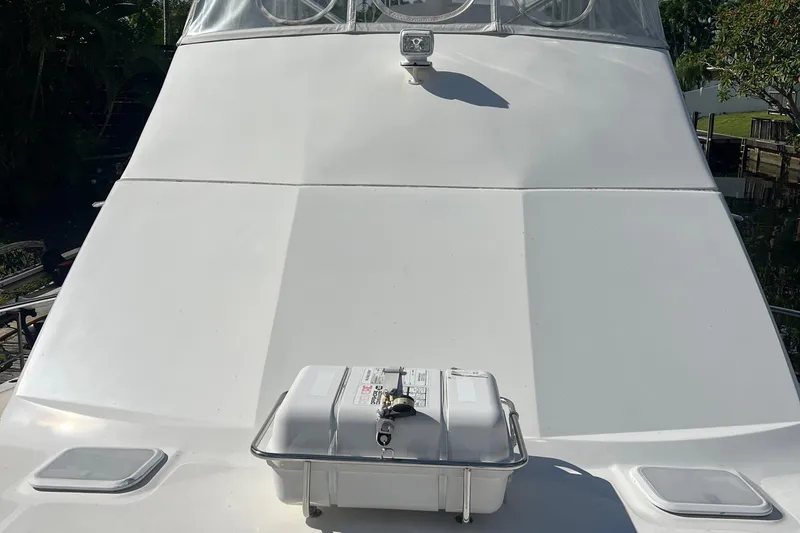 Slide: The Image of 2008 Luhrs 35 Convertible boat deck with safety equipment and clear sky. - 15