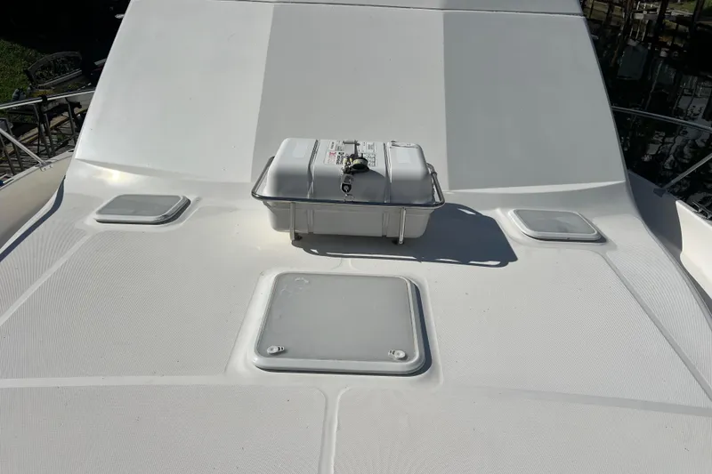 Slide: The Image of 2008 Luhrs 35 Convertible boat deck with storage compartments and equipment. - 18