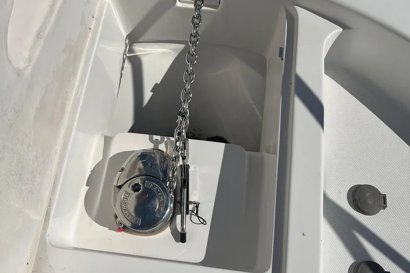 Slide: The Image of Anchor chain compartment on 2008 Luhrs 35 Convertible boat, featuring a windlass system. - 19