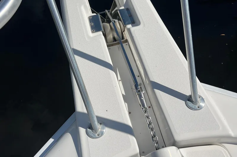 Slide: The Image of Bow of 2008 Luhrs 35 Convertible boat with anchor chain and railings. - 21
