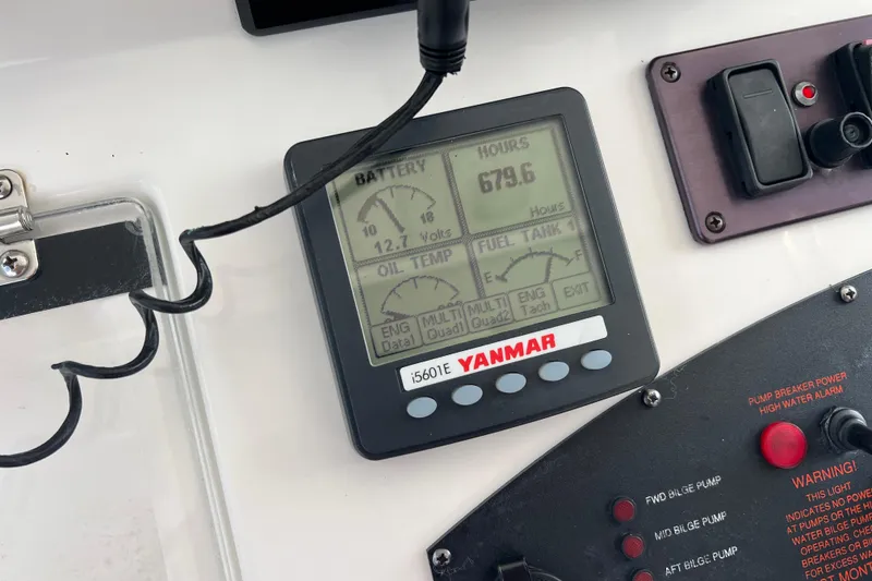 Slide: The Image of Yanmar engine display on 2008 Luhrs 35 Convertible boat dashboard. - 22