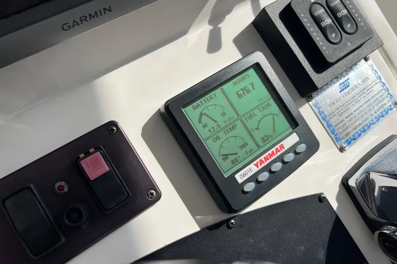 Slide: The Image of Yanmar engine display on 2008 Luhrs 35 Convertible boat dashboard with Garmin equipment. - 24
