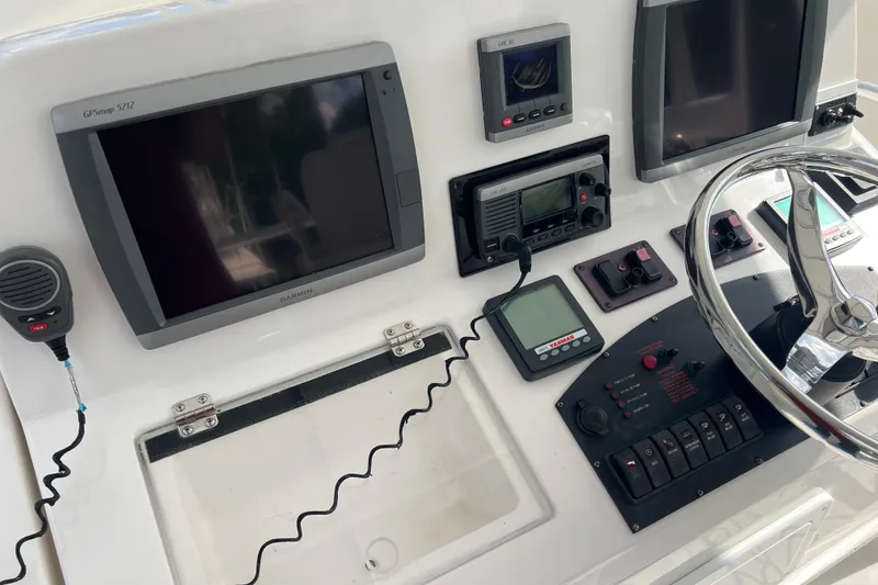Slide: The Image of Control panel of 2008 Luhrs 35 Convertible boat with Garmin GPS and navigation equipment. - 25