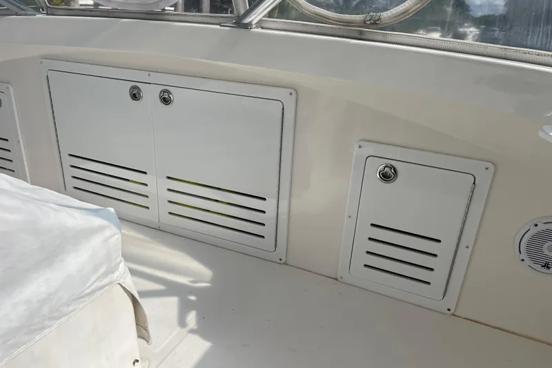 Slide: The Image of 2008 Luhrs 35 Convertible boat interior with storage compartments and speaker. - 27