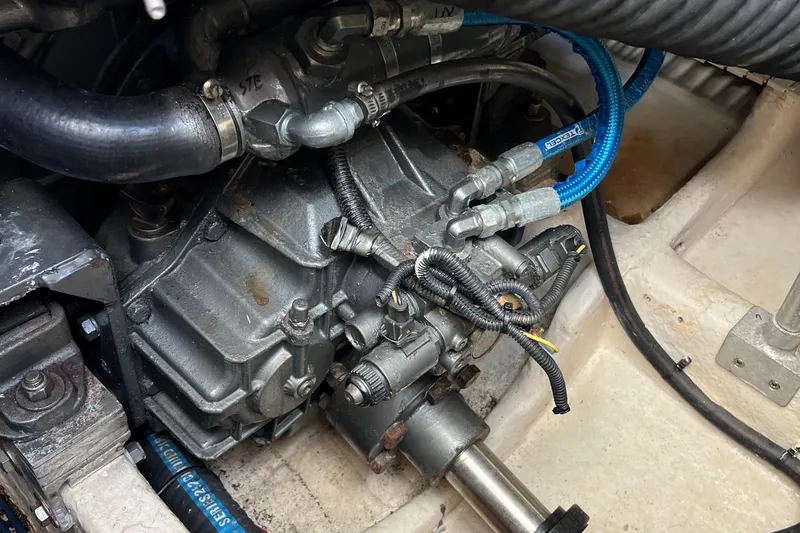 Slide: The Image of Engine compartment of a 2008 Luhrs 35 Convertible boat, showing mechanical components and hoses. - 35