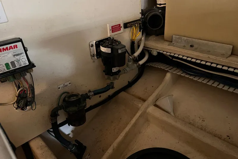 Slide: The Image of Engine room of 2008 Luhrs 35 Convertible boat, showing electrical and plumbing components. - 40