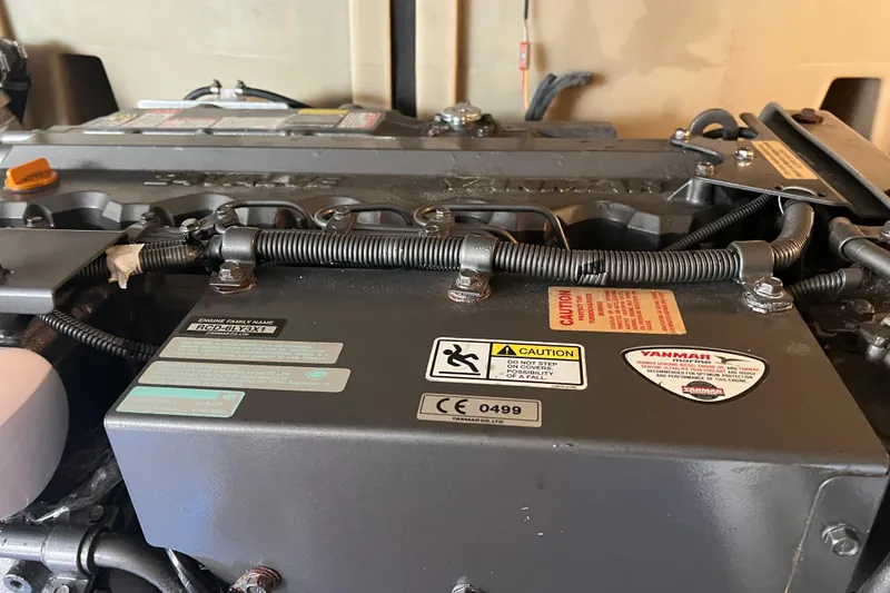 Slide: The Image of Engine compartment of a 2008 Luhrs 35 Convertible boat, featuring Yanmar components. - 44