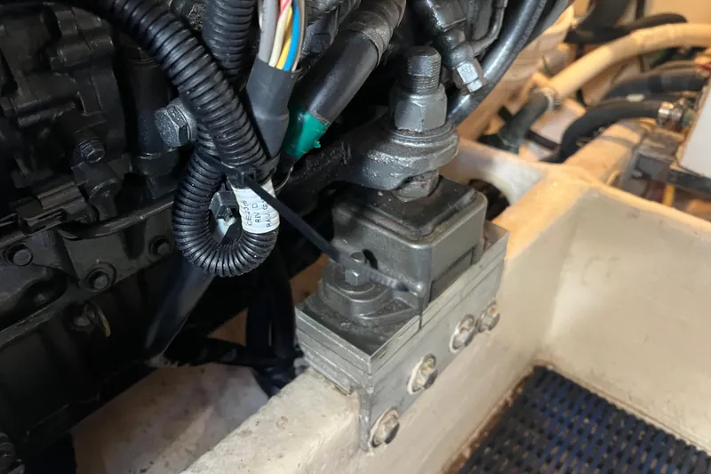 Slide: The Image of Engine component of 2008 Luhrs 35 Convertible boat, featuring wiring and mechanical parts. - 47