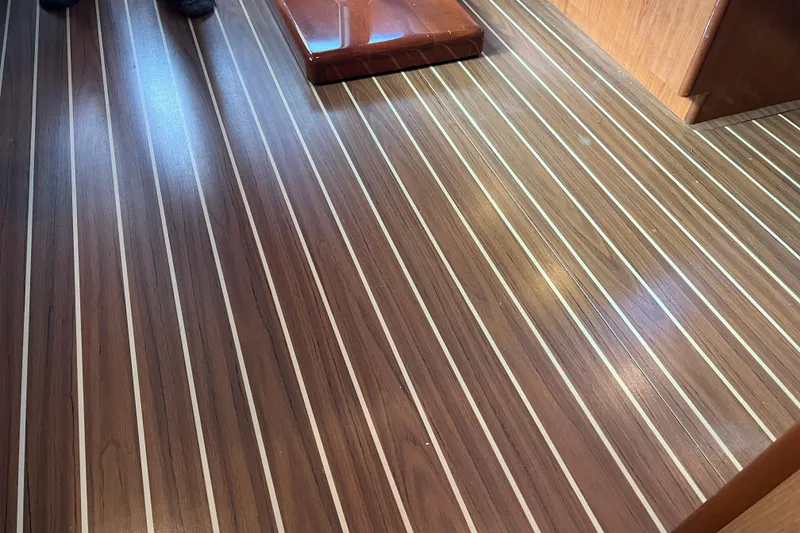 Slide: The Image of Teak and holly flooring on 2008 Luhrs 35 Convertible boat interior. - 51