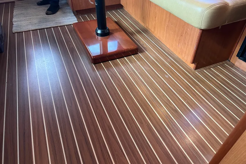 Slide: The Image of Luhrs 35 Convertible 2008 interior with polished wood flooring and cushioned seating. - 52