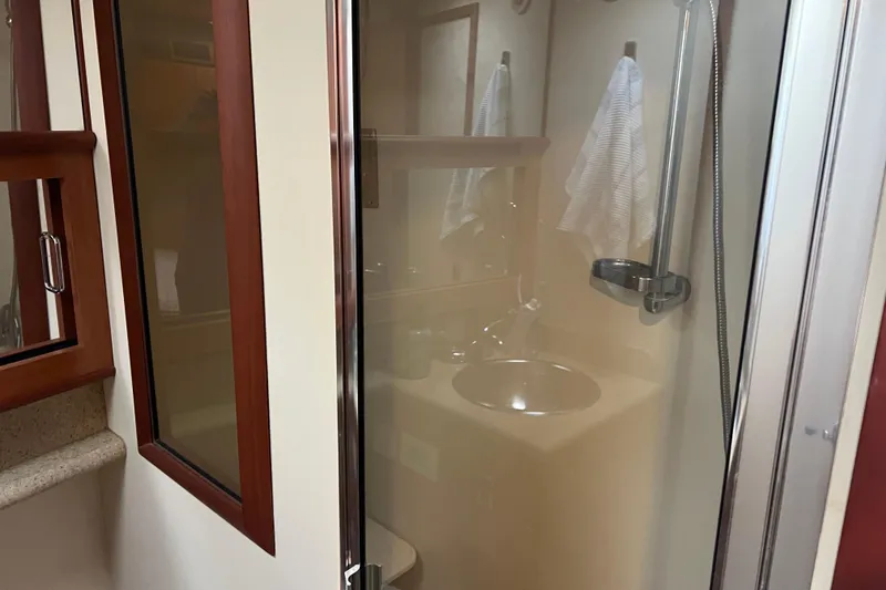 Slide: The Image of Bathroom interior of 2008 Luhrs 35 Convertible yacht with shower and sink. - 55