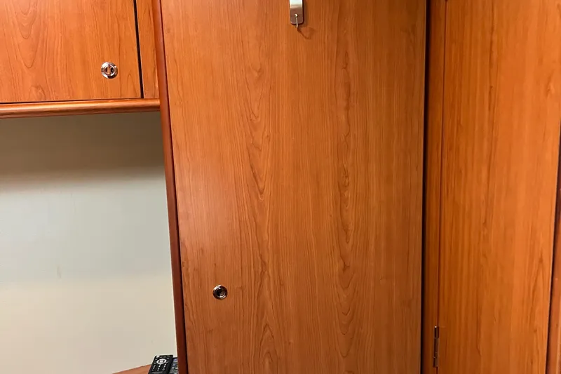 Slide: The Image of Wooden interior cabinetry of a 2008 Luhrs 35 Convertible boat. - 58