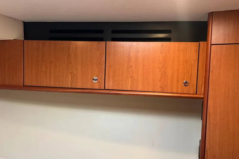 Slide: The Image of Wooden cabinets inside 2008 Luhrs 35 Convertible boat interior. - 59