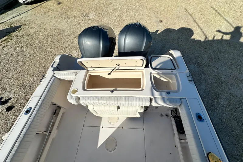 Slide: The Image of 2005 Grady-White Release 283 boat with dual engines and open storage compartments. - 10