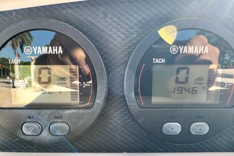 Slide: The Image of Yamaha tachometers on a 2005 Grady-White Release 283 boat, displaying engine hours. - 17
