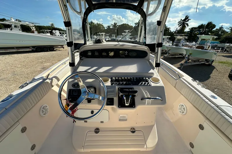 Slide: The Image of 2005 Grady-White Release 283 boat cockpit with steering wheel and control panel. - 19
